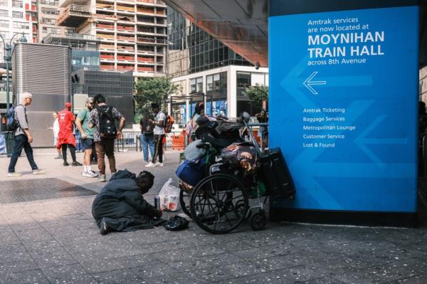 A homeless man with a cart full of his belo<em></em>ngings near the station's entrance on Aug. 24, 2024.