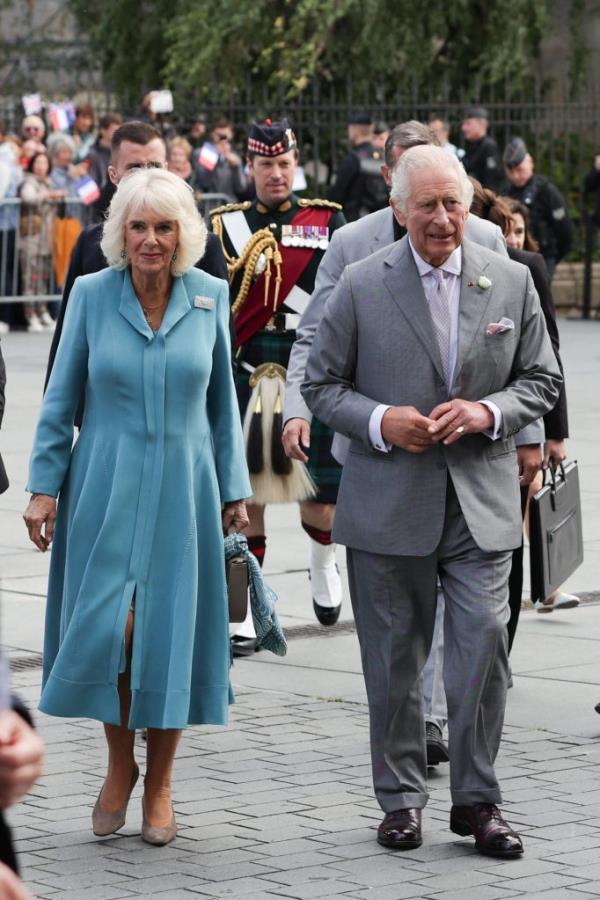 King Charles III and Queen Camilla, escorted by Major Johnny Thompson, arriving at Bordeaux's City Hall during their state visit to France