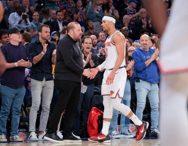 Knicks guard Josh Hart #3 is greeted by head coach Tom Thibodeau as he walks back to the bench.