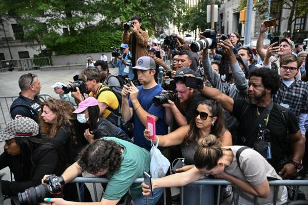 Members of the media gather as they listen to a press co<em></em>nference with Marc Agnifilo, lawyer for rapper and music producer Sean 