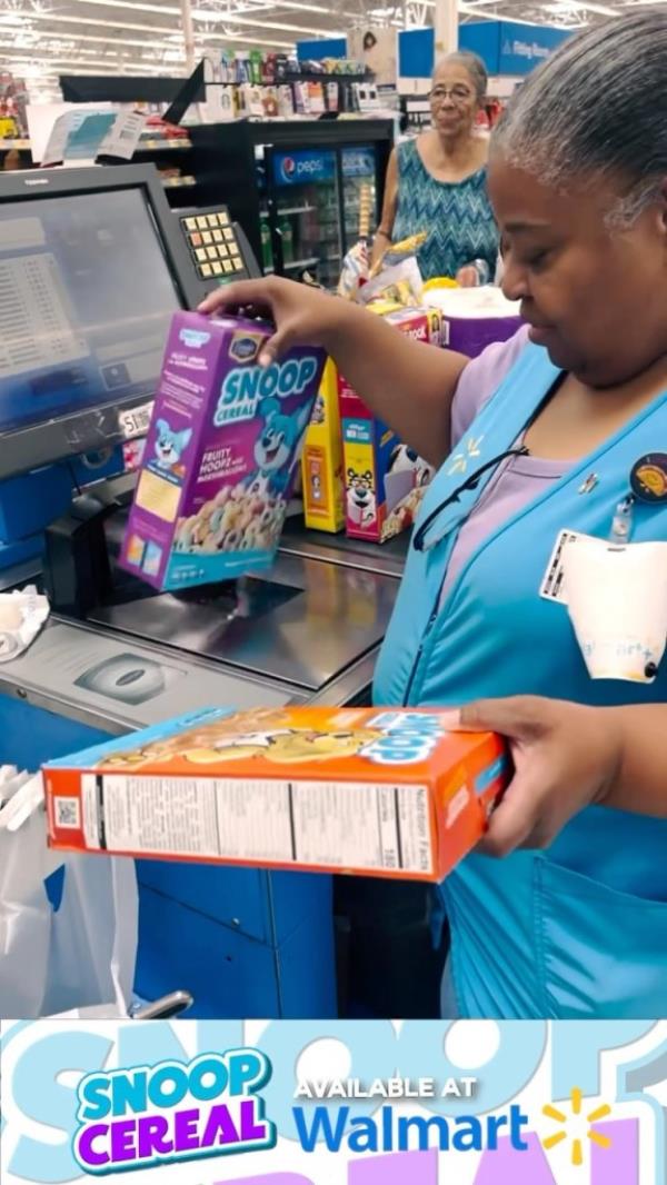 A Walmart employee scanning a box. 