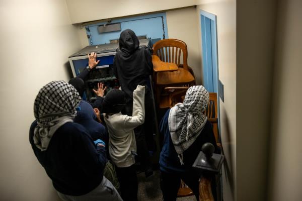 Protesters barricade themselves inside Hamilton Hall.