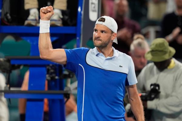 Grigor Dimitrov of Bulgaria celebrates after defeating Carlos Alcaraz of Spain during the Miami Open tennis tournament.