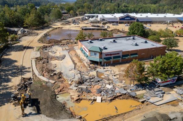 Oct 3, 2024; Asheville, NC, USA; Debris litters the area surrounding the Swannanoa River during the aftermath of flooding caused by the remnants of Hurricane Helene.