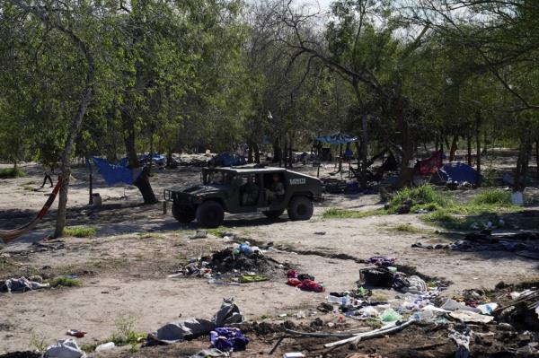 Members of the Mexican army patrol the migrant camp, after a significant portion of the area was cleared by authorities, in Matamoros, Mexico, December 28, 2023.