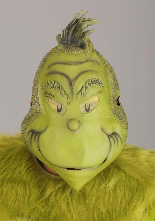 A scary Grinch mask with green fur and an angry ex<em></em>pression.