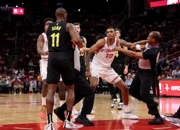 Houston Rockets forward Jabari Smith Jr. (10) and Utah Jazz guard Kris Dunn separated after a scuffle on March 23, 2024 in Houston, Texas.