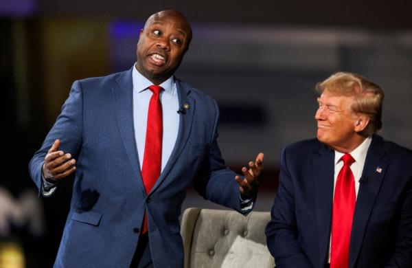 Senator Tim Scott (R-SC) and former U.S. President and Republican presidential candidate Do<em></em>nald Trump participate in a Fox News town hall with Laura Ingraham in Greenville, South Carolina, U.S. February 20, 2024.