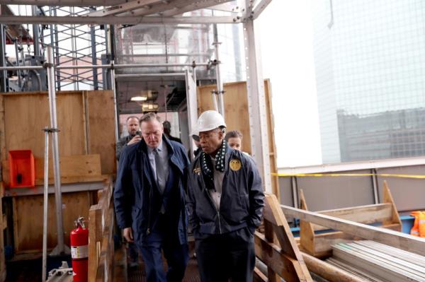 Mayor Eric Adams touring 160 Water Street in Manhattan wher<em></em>e the  Vanbarton Group is co<em></em>nverting an office building into housing.