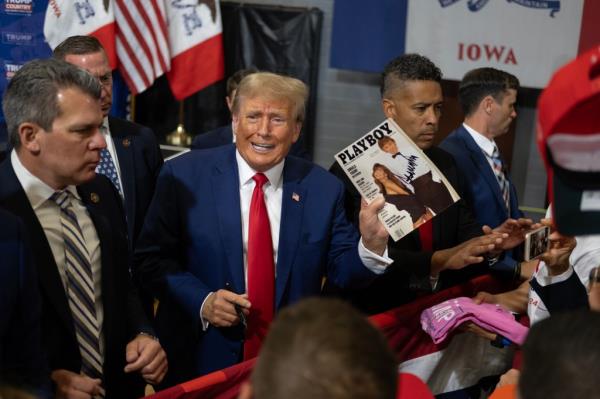 Former President Do<em></em>nald Trump signs items for a crowd of supporters at the Fort Dodge Senior High School.