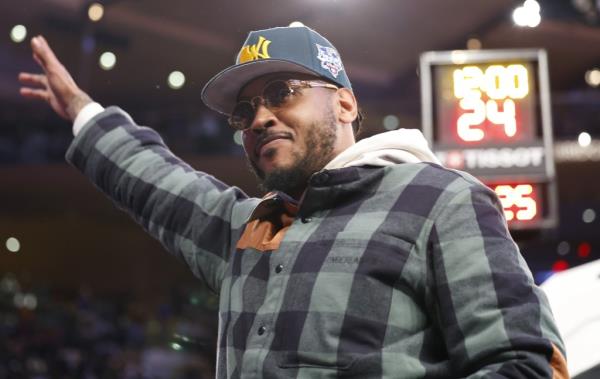 Carmelo Anthony waves to Knicks fans during the first half of their 116-102 loss to the Celtics.