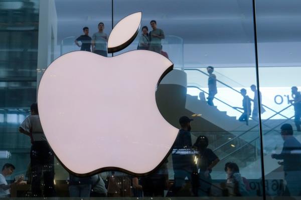 The Apple logo on the door of an Apple store