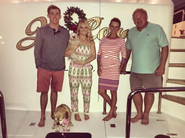 The retired doctor is pictured with his family aboard the yacht in an undated photo. 