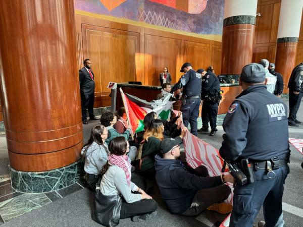 Some of the protestors sat on the lobby floor.