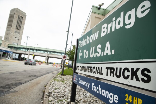 FILE - A vehicle crosses the Internatio<em></em>nal Rainbow Bridge from Niagara Falls, Ontario, into Niagara Falls, N.Y. on Wednesday, Oct. 13, 2021. A border crossing between the U.S. and Canada has been closed Wednesday, Nov. 22, 2023, after a vehicle exploded at a checkpoint on a bridge near Niagara Falls. The FBI's field office in Buffalo said in a statement that it was investigating the explosion on the Rainbow Bridge, which co<em></em>nnects the two countries across the Niagara River. (Aaron Lynett/The Canadian Press via AP, File)