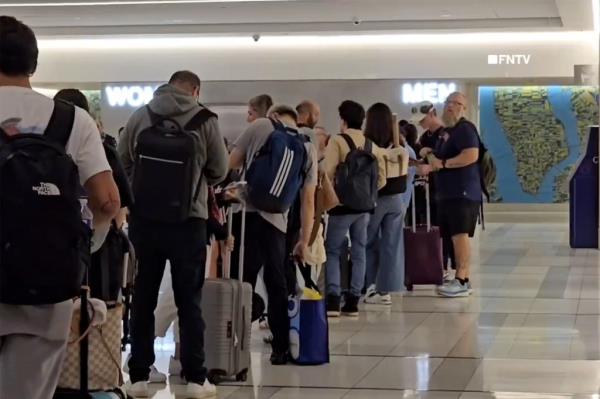 Long lines developed at LGA because of the travel pains. 