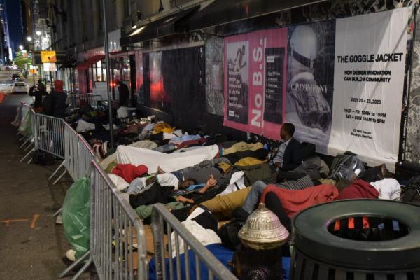 Migrants sleeping outside of the shelter at the Roosevelt Hotel last week.