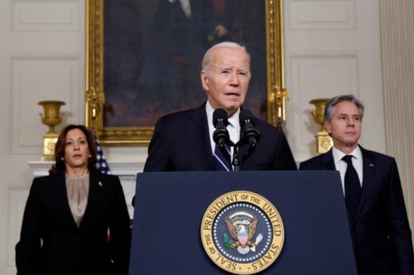 President Joe Biden (middle) made remarks after speaking by phone with Israeli Prime Minister Benjamin Netanyahu a<em></em>bout the situation in Israel following Hamas' deadly attacks