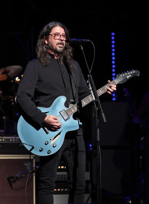 Dave Grohl performs at LOVE ROCKS NYC Benefit Concert.