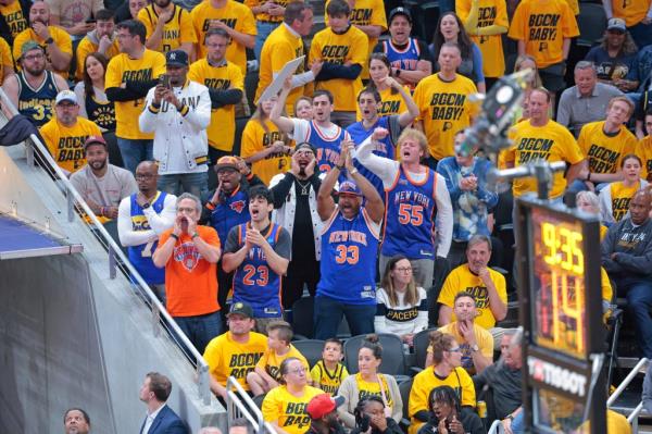 New York Knicks fans cheer during the fourth quarter of Game 3.