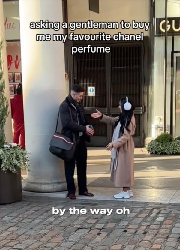 Layzell talking to man on the street asking for perfume