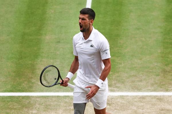 Novak Djokovic of Serbia reacts as he plays against Carlos Alcaraz of Spain in the Gentlemen's Singles Final.