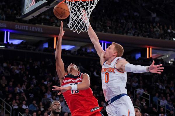 Jordan Poole, who scored 41 points, is fouled by Do<em></em>nte DiVencenzo during the Knicks' 131-106 blowout loss to the Wizards in their preseason finale.