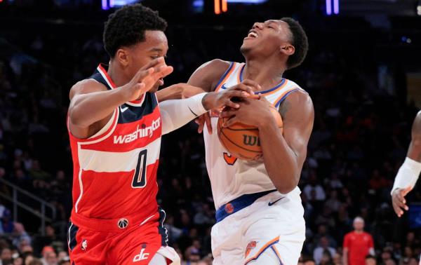 RJ Barrett struggles to drive past Bilal Coulibaly during the third quarter of the Knicks' preseason loss.