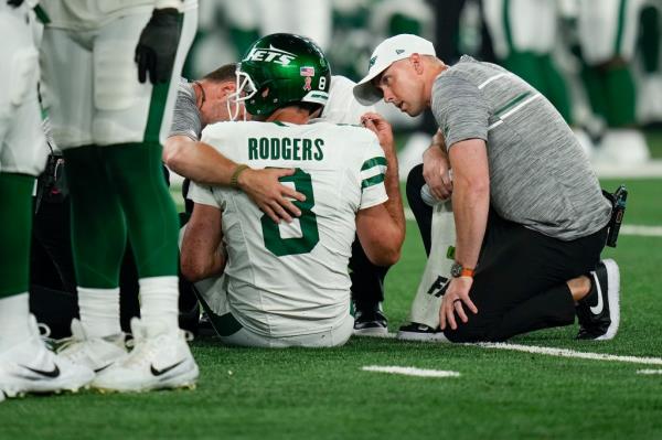 Rodgers sat down on the field after unsuccessfully attempting to walk off the injury. He was escorted to the medical tent moments later.