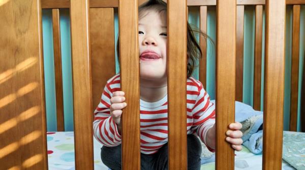 Toddler awake in crib