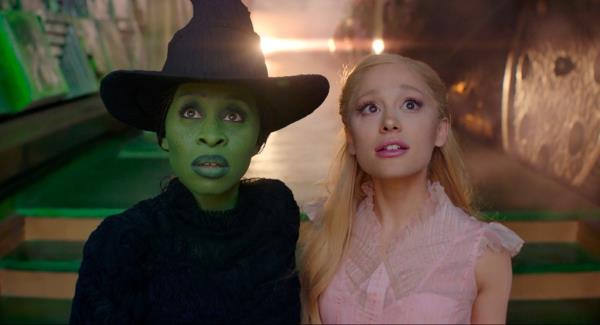 This image released by Universal Pictures shows Cynthia Erivo, left, and Ariana Grande in a scene from the film 