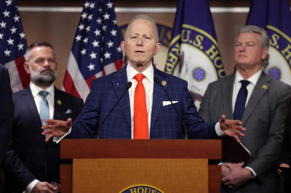 U.S. Rep. Jeff Van Drew speaking at a press co<em></em>nference at the U.S. Capitol a<em></em>bout President Trump's involvement with January 6, 2021, with other men in suits surrounding him