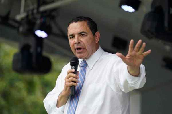 U.S. Rep. Henry Cuellar speaking into a microphone during a campaign event in San Antonio, Texas on May 4, 2022