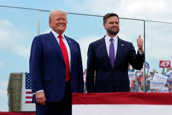 Republican presidential nominee former President Do<em></em>nald Trump and Republican vice presidential nominee Sen. JD Vance, R-Ohio, stand on stage at a campaign rally at North Carolina Aviation Museum, Wednesday, Aug. 21, 2024, in Asheboro, N.C.