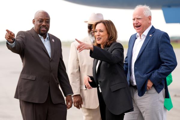 Democratic presidential nominee Vice President Kamala Harris and Democratic vice presidential candidate Minnesota Gov. Tim Walz look at the campaign bus with Savannah Mayor Van Johnson, left, at the Savannah/Hilton Head Internatio<em></em>nal Airport in Savannah, Ga., as they arrive for campaign events, Wednesday, Aug. 28, 2024.