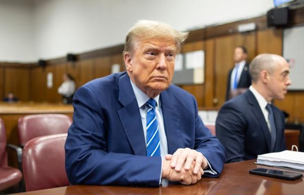 Former President Do<em></em>nald Trump awaits the start of proceedings on the second day of jury selection at Manhattan criminal court, April 16, 2024, in New York.