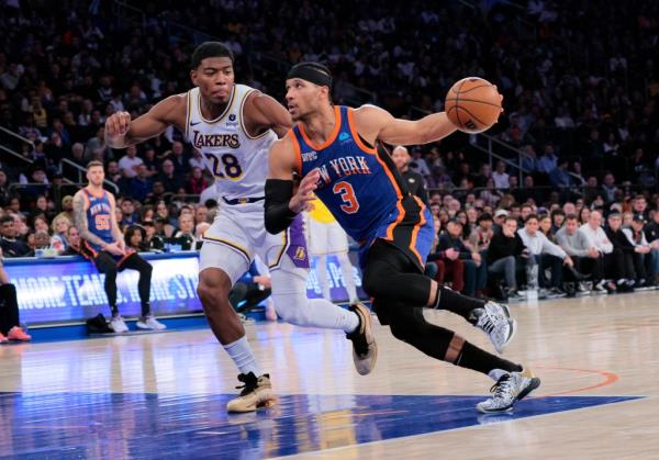 Josh Hart, who had 12 points and 11 rebounds, drives on Rui Hachimura during the Knicks' loss.