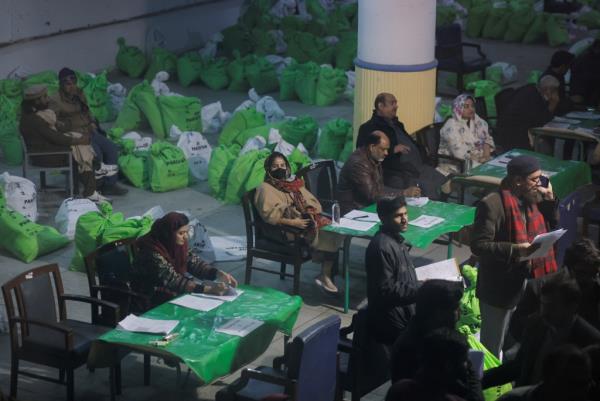 Members of the election commission work to distribute materials for the general election in Lahore, Pakistan on Feb. 7, 2024. 