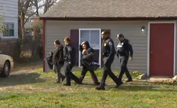 Police escort the babies and their families from the home of the Good Samaritan who found them.