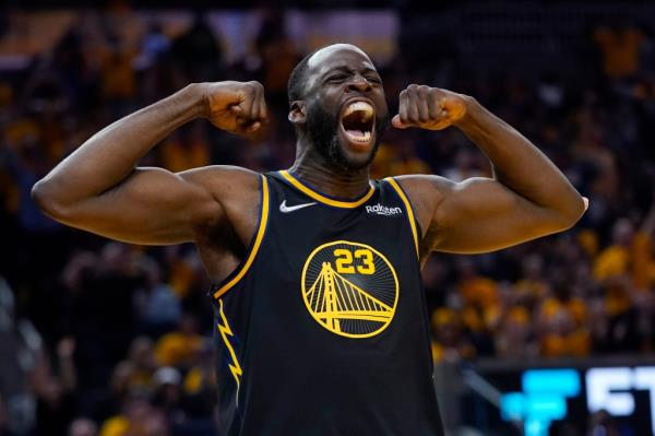 Golden State Warriors forward Draymond Green celebrates after scoring against the Dallas Mavericks during the second half in Game 5 of the NBA basketball playoffs Western Co<em></em>nference finals in San Francisco, Thursday, May 26, 2022.