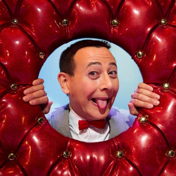 Paul Reubens, in character as Pee-wee Herman, poses on stage after a 2010 performance of 