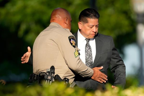 Former Uvalde Co<em></em>nsolidated Independent School District police officer Adrian Go<em></em>nzales arrives at the Uvalde County Courthouse