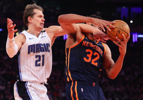 Karl-Anthony Towns is fouled by Mo Wagner during the Knicks' 121-106 win over the Magic on Dec. 3, 2024.