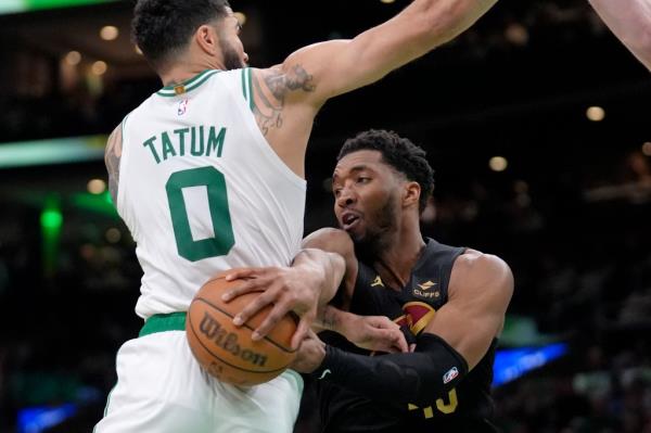 Do<em></em>novan Mitchell looks to make a pass around Jayson Tatum during the Cavaliers' Game 2 victory.