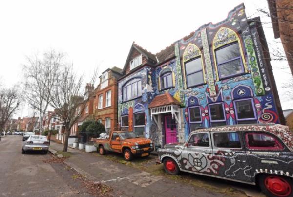 Carrie Reichardt, 55, from Chiswick, London, first fell in love with mosaicking when she completed her garden in 1997.) - This mum has spent the last two decades covering the outside of her home in colourful mosaics. Carrie Reichardt, 55, from Chiswick, London, first fell in love with mosaicking when she completed her garden in 1997. Since then, she caught the bug for it and co<em></em>ntinued to cover her entire house in colourful mosaics which she says depicts the story of events that have happened throughout her life. She says that despite her house being - by far - the most colourful on her road that her neighbours love her designs. - SEE CATERS COPY