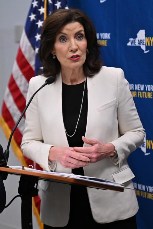 Gov. Kathy Hochul speaks in front of a U.S. flag.