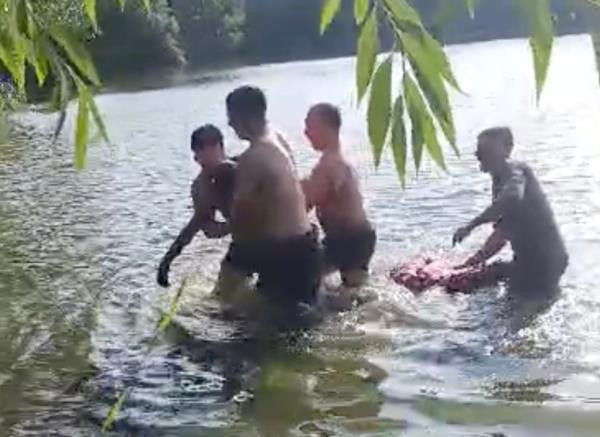 EMS pulls the boy from the water.