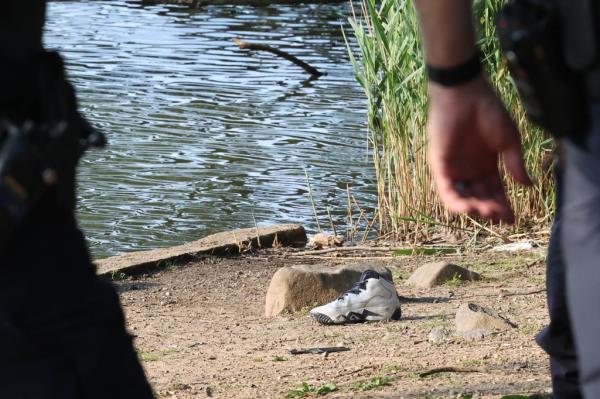 The boy's shoe on the bank.