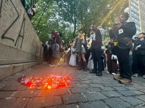 Protesters set a<em></em>bout vandalizing a World War I memorial and burned a US flag near Central Park.