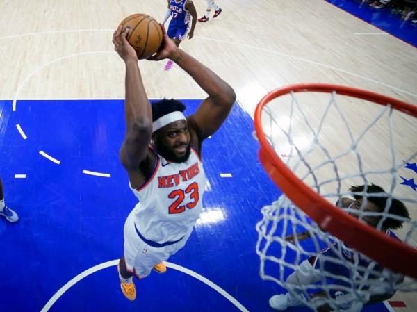 New York Knicks' Mitchell Robinson (23) dunks during the second half of Game 6 in an NBA basketball first-round playoff series against the Philadelphia 76ers, May 2, 2024, in Philadelphia.